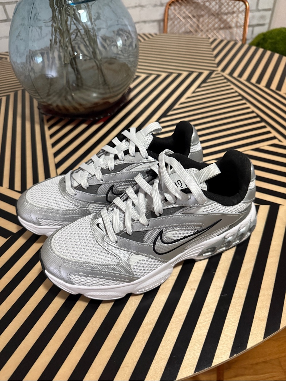 Nike Silver and White Women's Sneakers with Black Swoosh